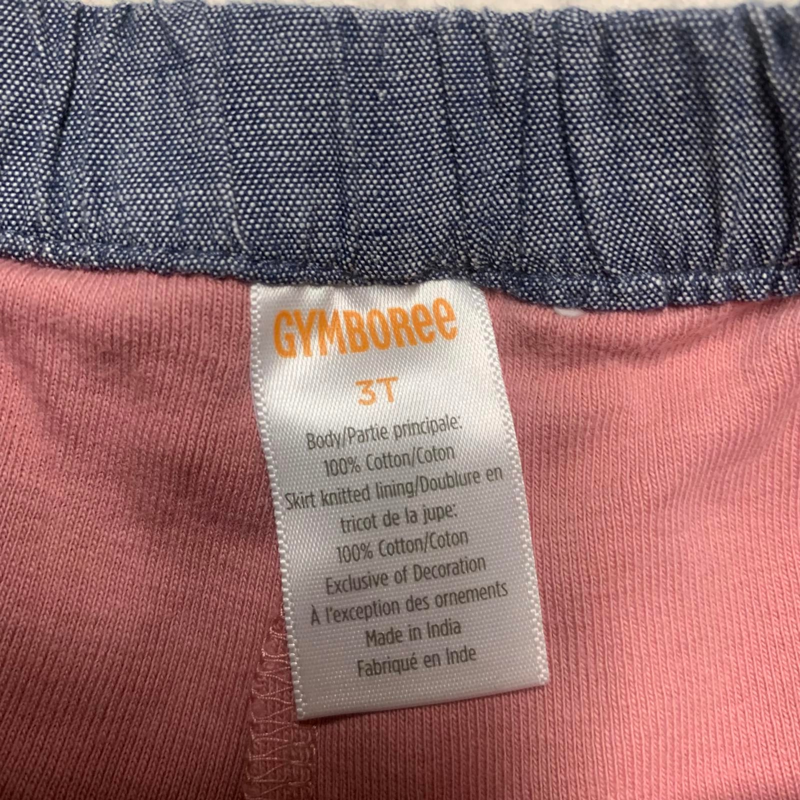 Falda vaquera azul con bordado floral y pantalones cortos rosas para niñas Gymboree talla 3T