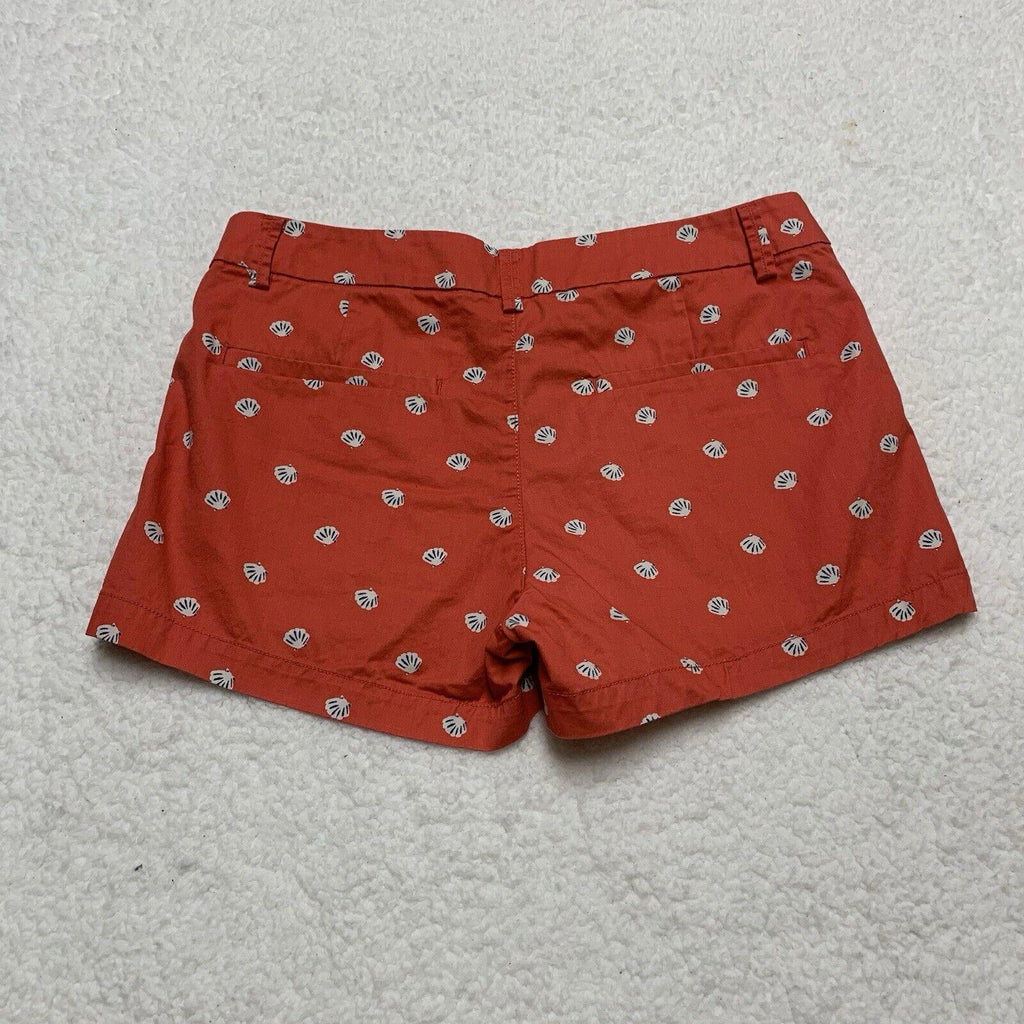 Pantalones cortos Uniqlo con estampado de conchas marinas, talla 2, parte delantera plana, color coral