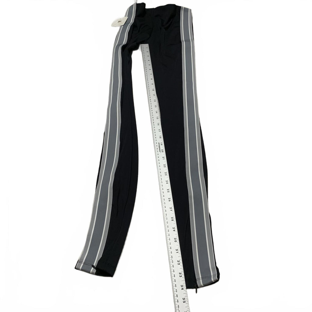 Leggings negros con rayas laterales y cremalleras en los tobillos de Fabletic para mujer, talla pequeña