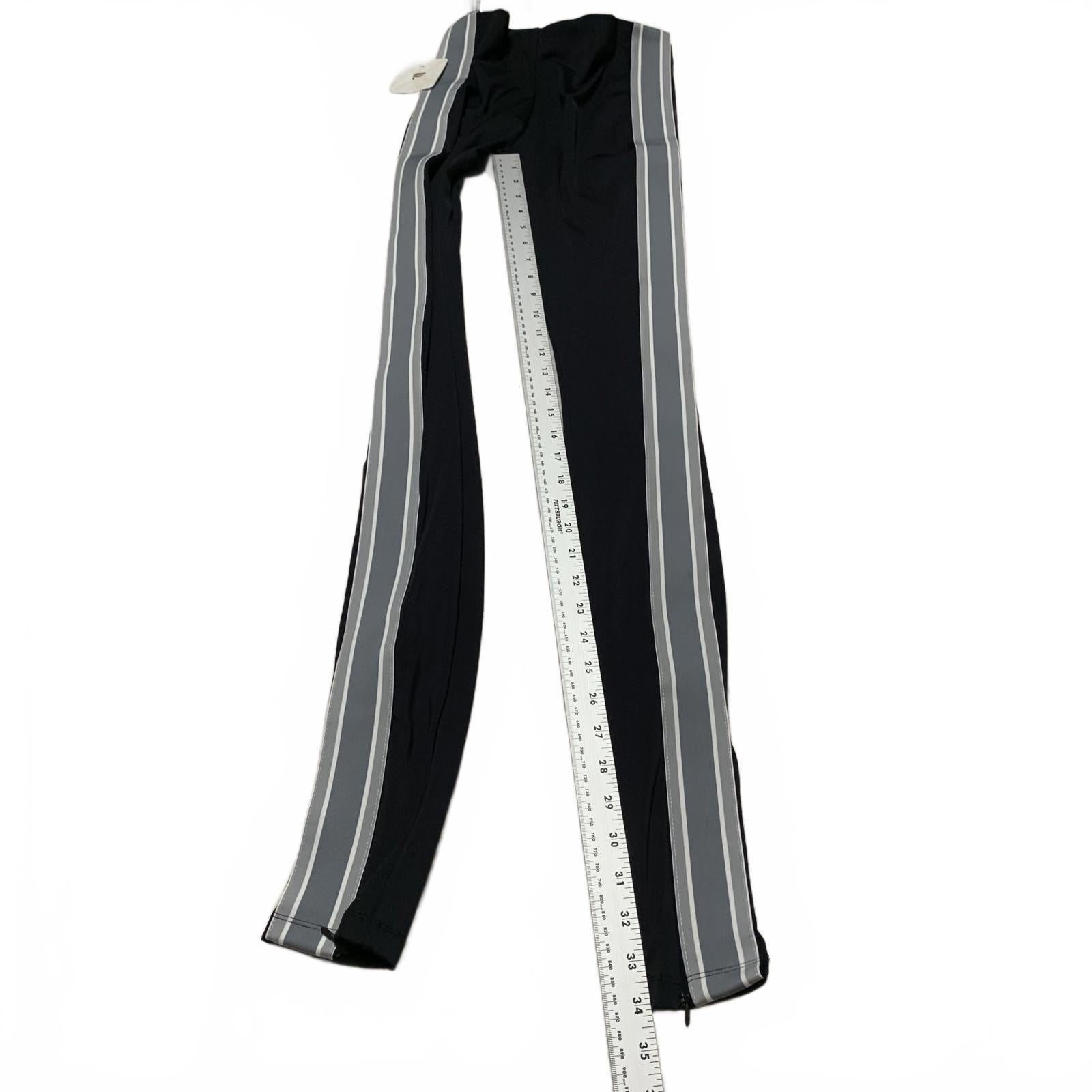 Leggings negros con rayas laterales y cremalleras en los tobillos de Fabletic para mujer, talla pequeña