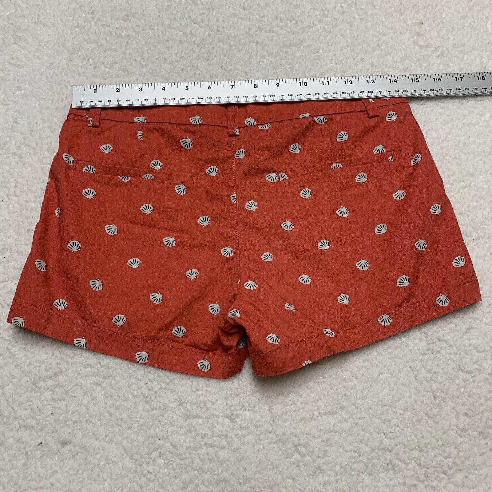 Pantalones cortos Uniqlo con estampado de conchas marinas, talla 2, parte delantera plana, color coral
