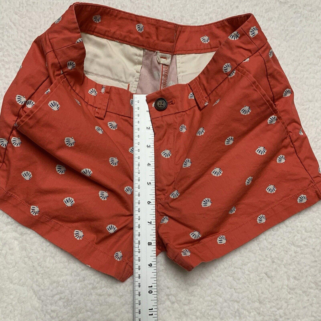 Pantalones cortos Uniqlo con estampado de conchas marinas, talla 2, parte delantera plana, color coral
