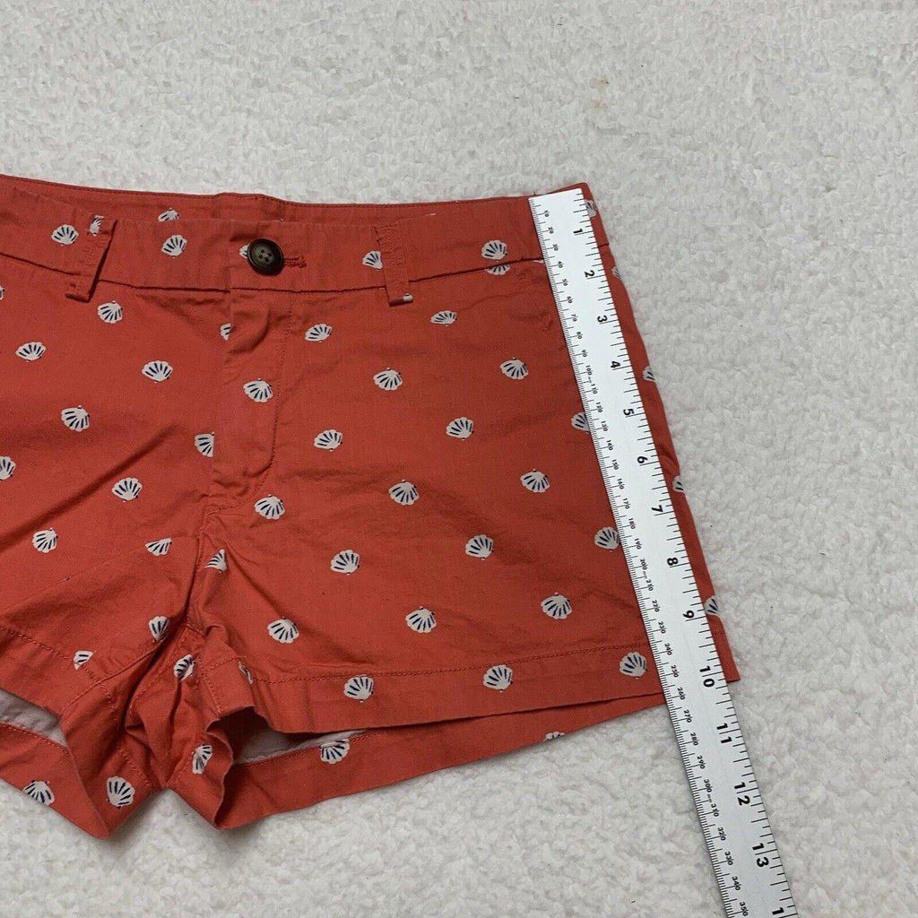 Pantalones cortos Uniqlo con estampado de conchas marinas, talla 2, parte delantera plana, color coral
