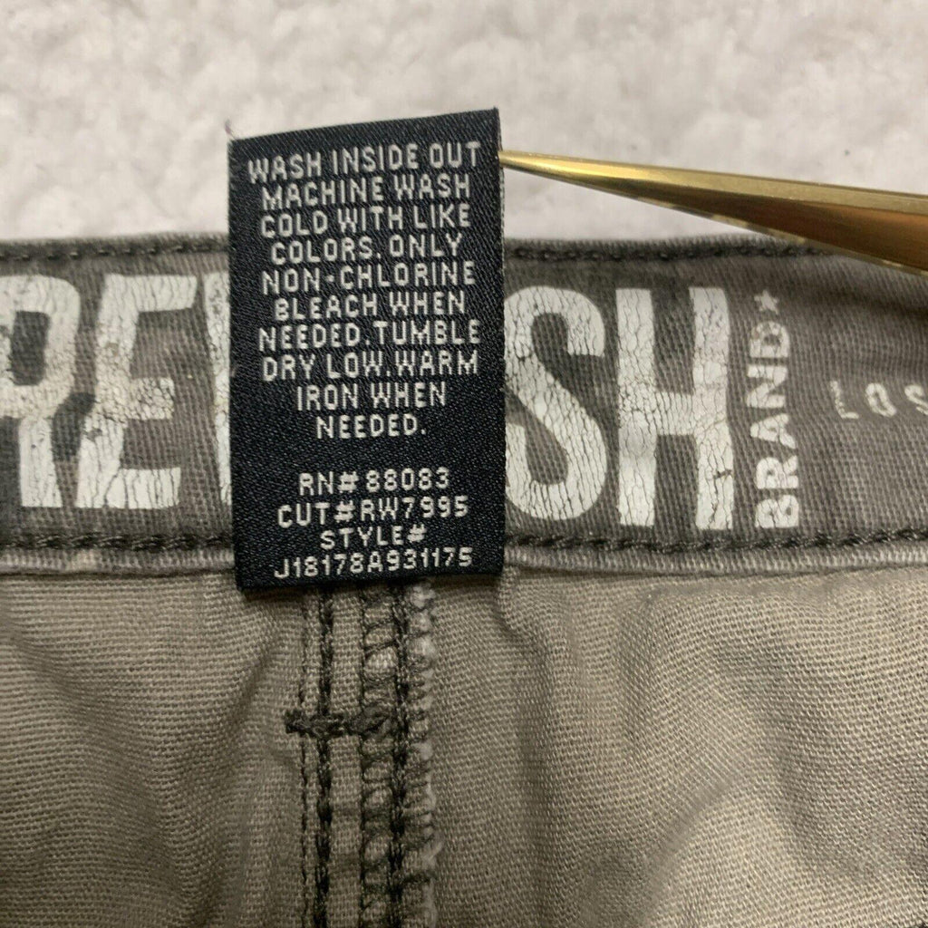 Pantalones rectos con estampado de camuflaje verde oliva para niños de la marca Rewash, talla 7/28