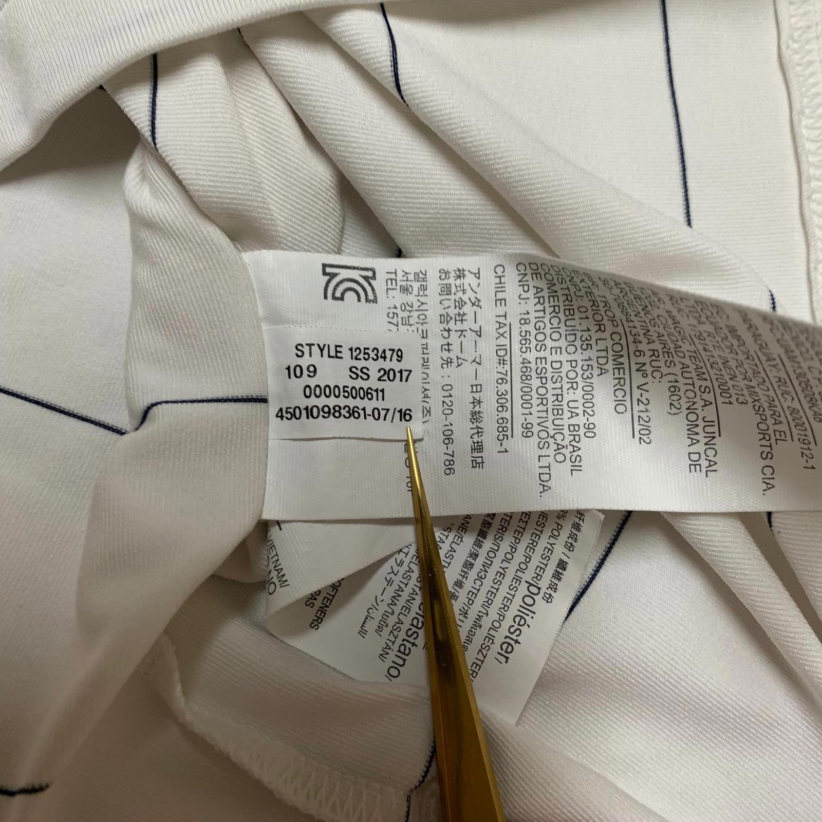 Polo Under Armour Heat Gear de rayas blancas y negras para hombre, talla mediana