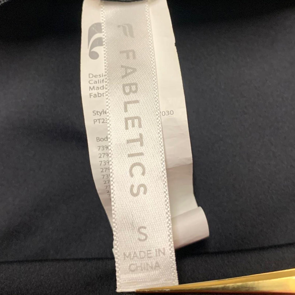 Leggings negros con rayas laterales y cremalleras en los tobillos de Fabletic para mujer, talla pequeña