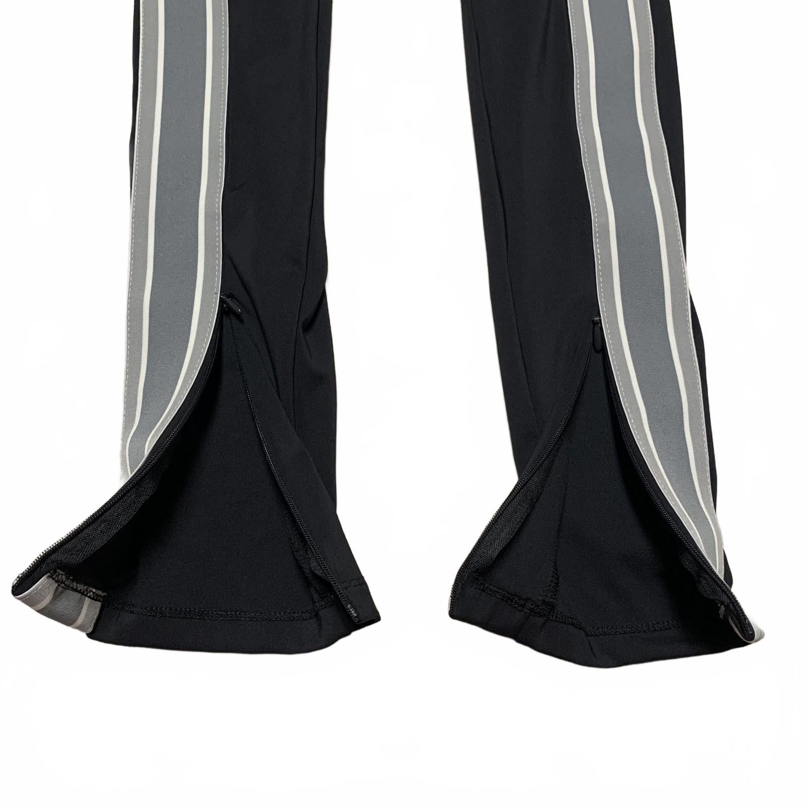 Leggings negros con rayas laterales y cremalleras en los tobillos de Fabletic para mujer, talla pequeña