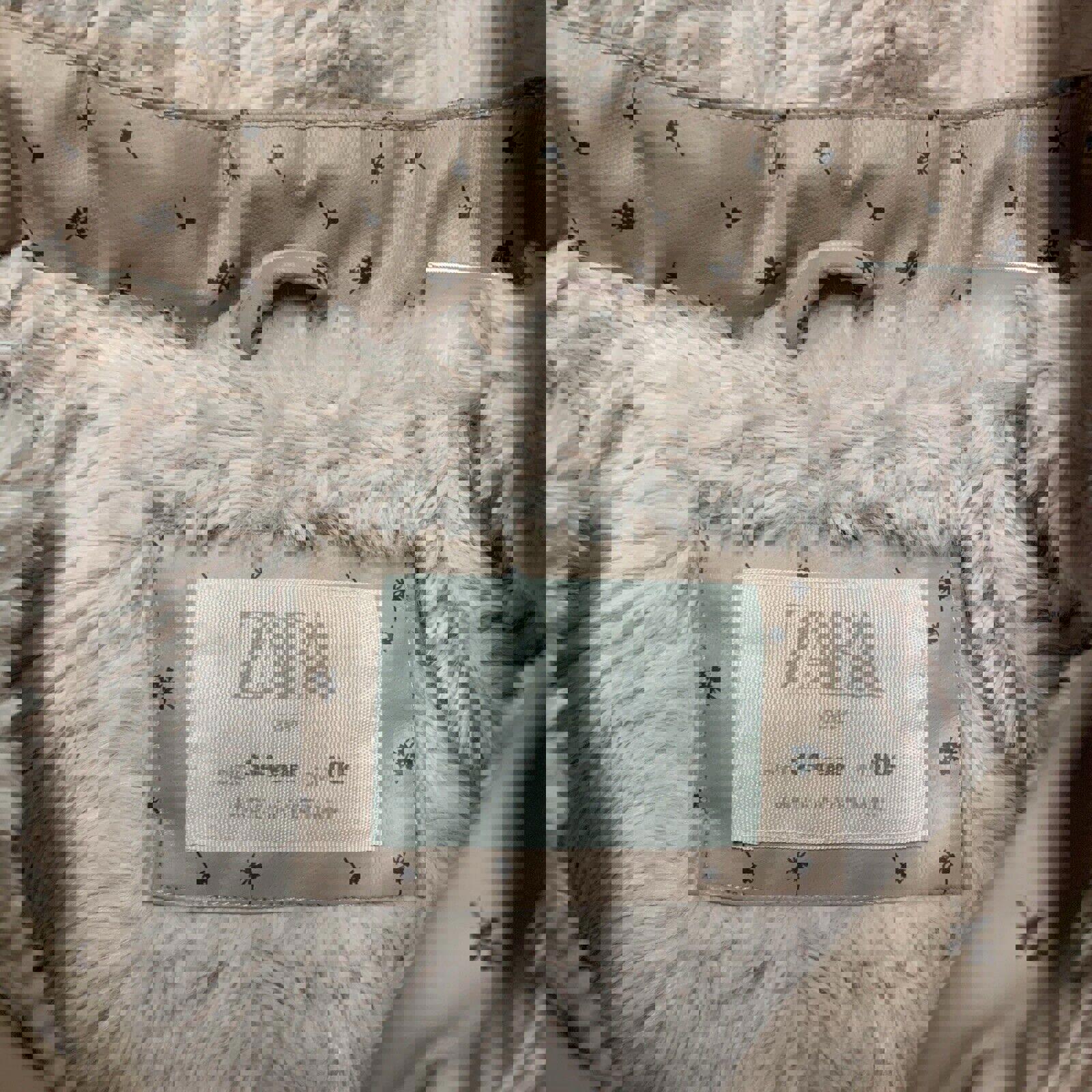 Chaqueta impermeable con capucha y forro polar con estampado floral rosa para niña de Zara, talla 3-4 años