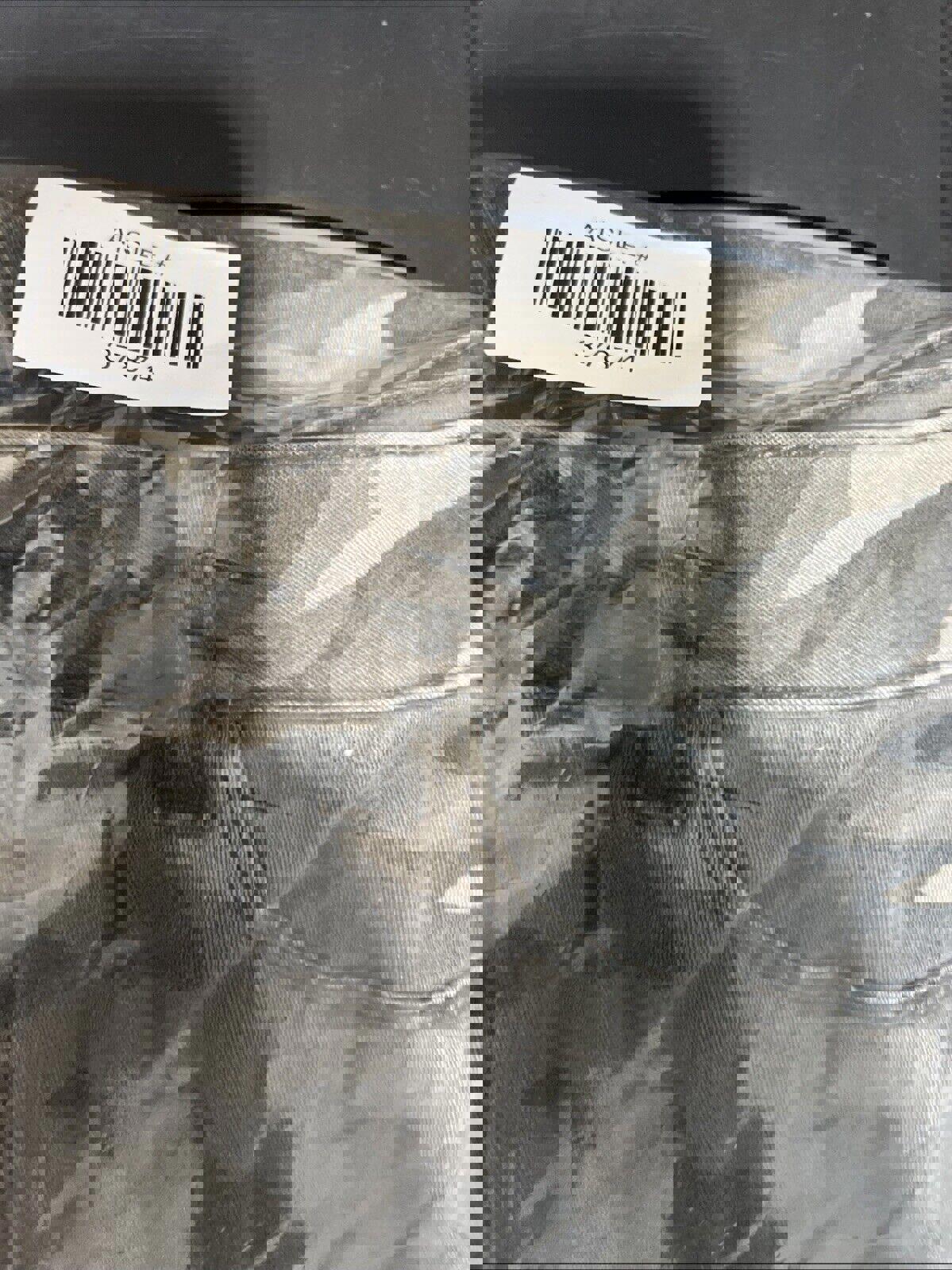 Pantalones rectos con estampado de camuflaje verde oliva para niños de la marca Rewash, talla 7/28