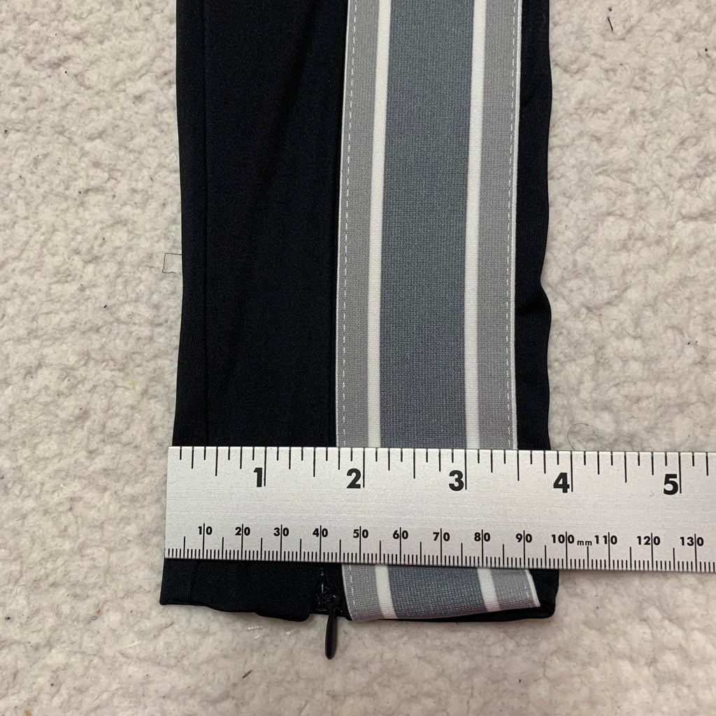 Leggings negros con rayas laterales y cremalleras en los tobillos de Fabletic para mujer, talla pequeña