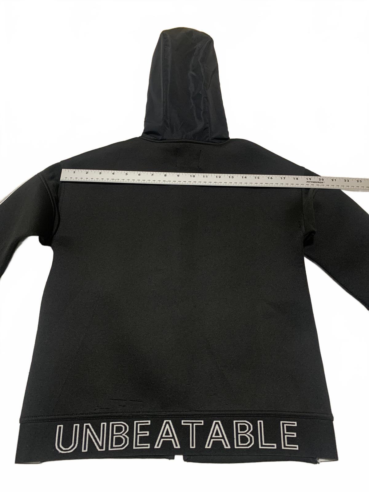 Sudadera con capucha y cremallera negra para niño de la colección Zara Kids, talla 9