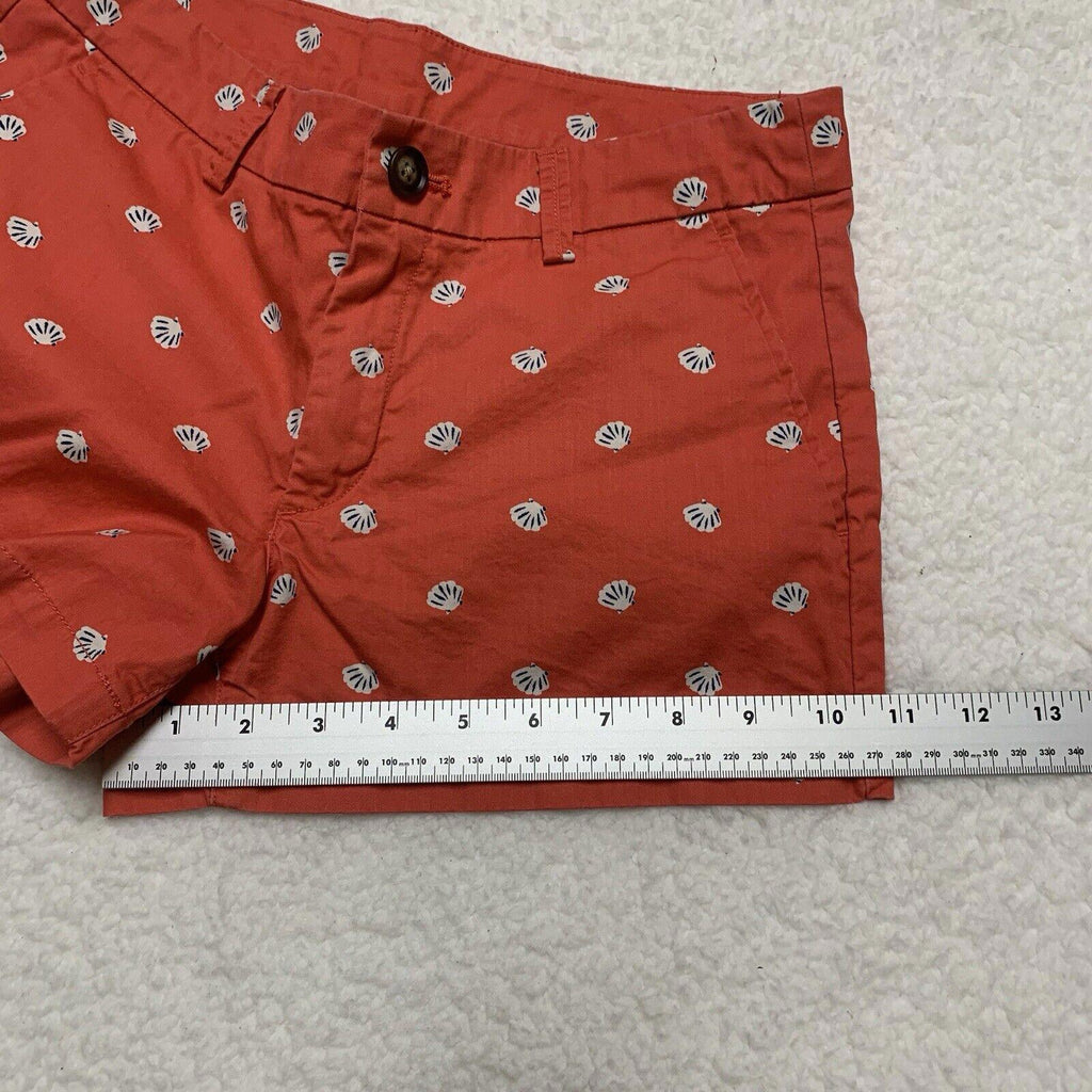 Pantalones cortos Uniqlo con estampado de conchas marinas, talla 2, parte delantera plana, color coral
