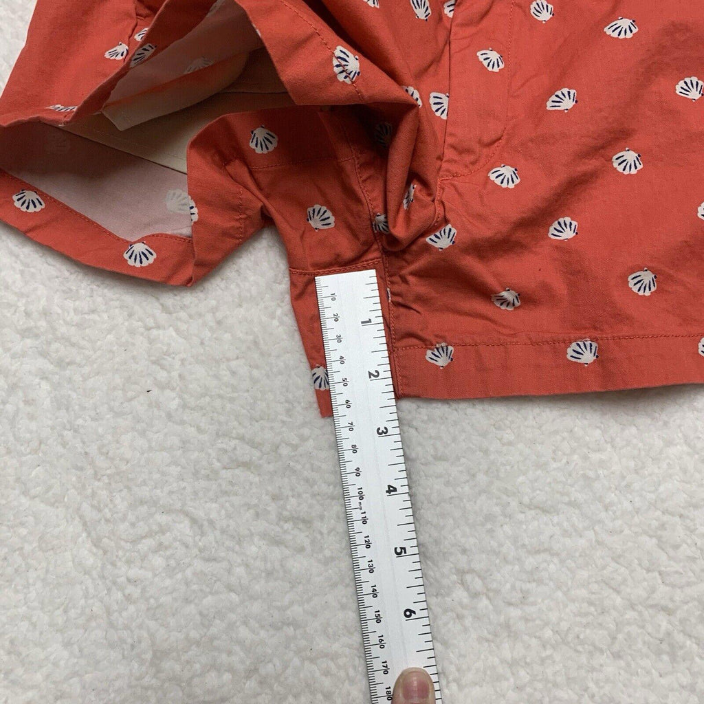 Pantalones cortos Uniqlo con estampado de conchas marinas, talla 2, parte delantera plana, color coral