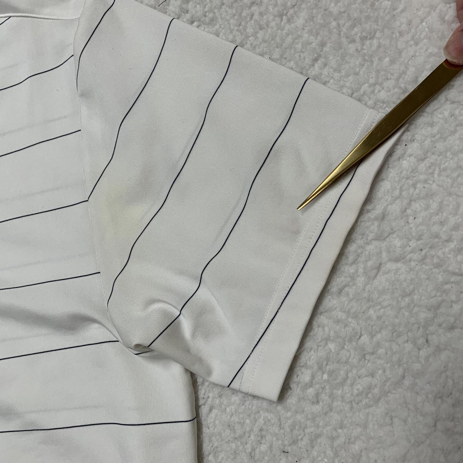 Polo Under Armour Heat Gear de rayas blancas y negras para hombre, talla mediana