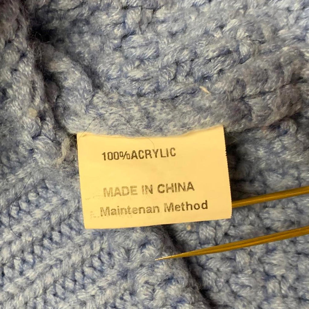 Suéter unisex azul con cuello redondo y textura para mujer